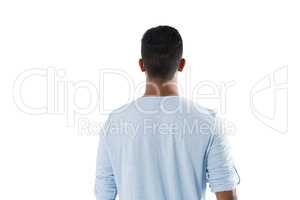 Man looking at invisible screen against white background