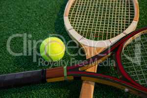 Close up of wooden racket with tennis ball