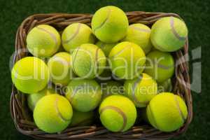Directly above shot of tennis balls in wicker basket