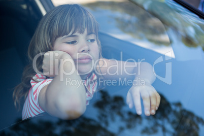 Teenage girl sitting in the car