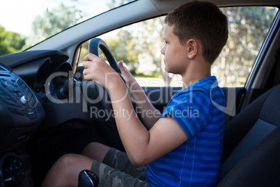 Teenage boy driving a car