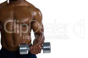 Mid section of muscular sportsman exercising with dumbbells