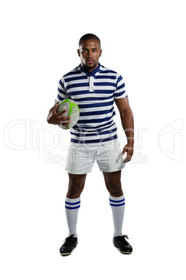 Portrait of sportsman wearing sports uniform holding rugby ball