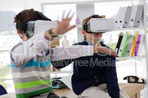 Kids as business executives using virtual reality headset