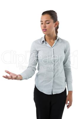 Female executive holding invisible object