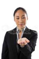 Female executive holding invisible object
