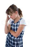 Sad girl standing against white background