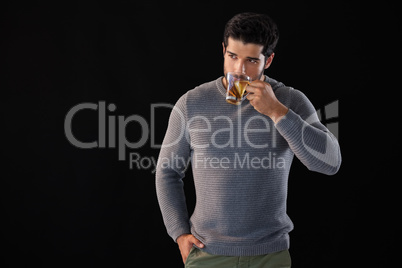 Thoughtful man having a cup of lemon tea