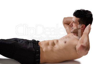 Side view of shirtless sports man doing exercise