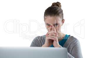 Teenage girl using laptop against white background