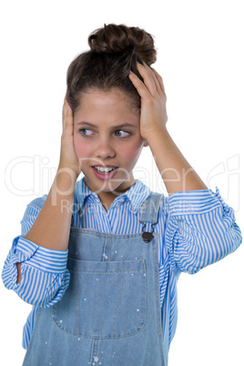 Teenage girl standing against white background