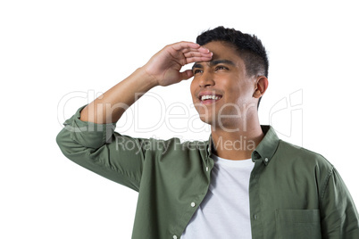 Man shielding eyes against white background