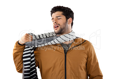 Man looking at his scarf