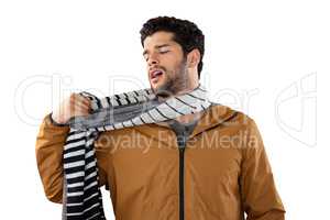 Man looking at his scarf