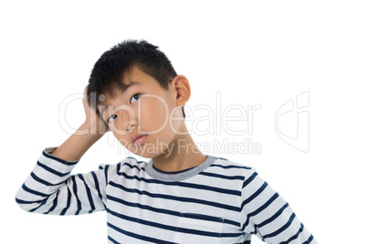 Boy standing against white background