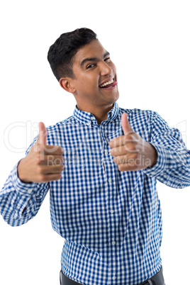 Portrait of happy man showing thumbs up