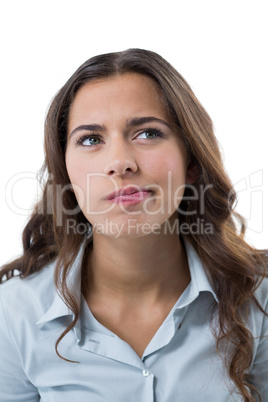 Female executive standing against white background