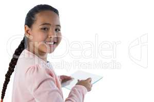 Girl using glass digital tablet against white background