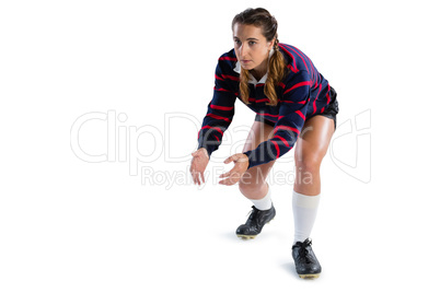 Full length of female rugby player in catching position