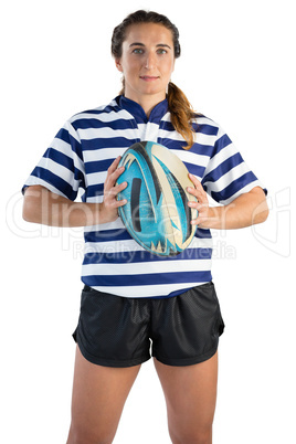 Portrait of female player holding rugby ball