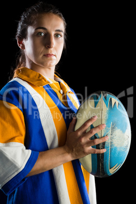 Portrait of confident female rugby player