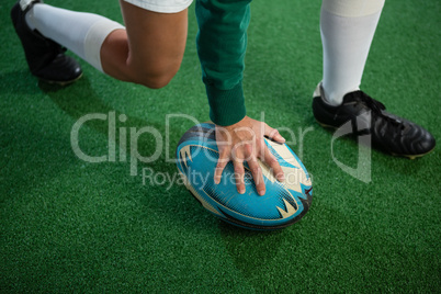 Low section of woman playing rugby