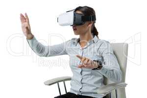 Female executive using virtual reality headset