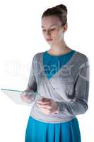 Teenage girl using a glass digital tablet