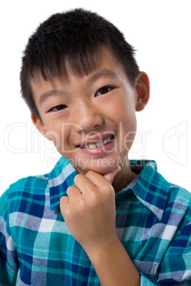 Happy boy posing against white background