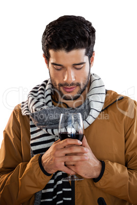 Man holding a glass of red wine