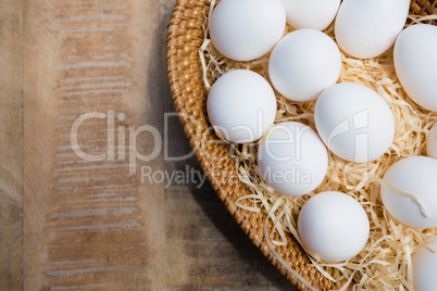 Fresh eggs in wicker basket