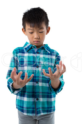 Boy pretending to hold invisible object