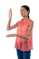 Woman gesturing against white background