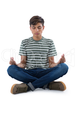 Teenage boy performing yoga