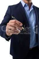 Businessman pretending to write on invisible screen