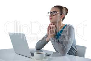 Teenage girl using laptop against white background