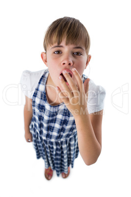 Cute girl yawing on white background