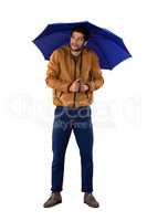 Man standing under umbrella