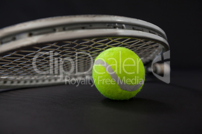Close up of ball and silver tennis racket