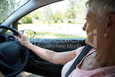 Senior woman driving a car