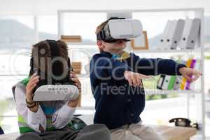 Kids as business executives using virtual reality headset