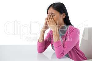 Woman relaxing against white background