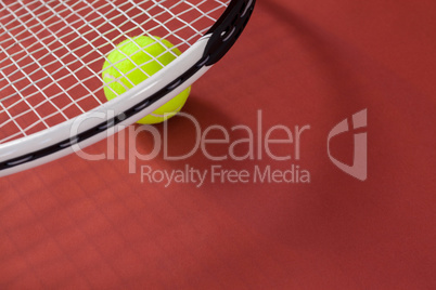 High angle view of white tennis racket with ball