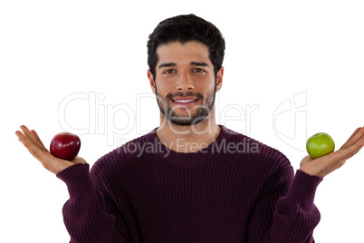 Portrait of smiling man holding apple