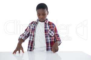 Boy pretending to touch an invisible screen