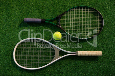 Overhead view of rackets with tennis ball