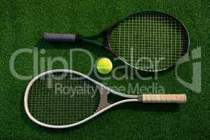 Overhead view of rackets with tennis ball