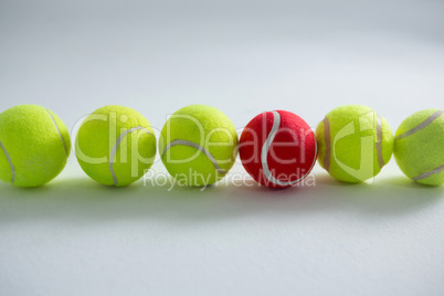 Tennis balls arranged side by side