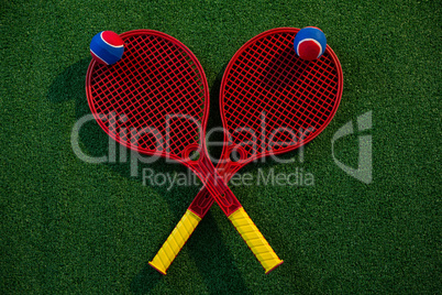 Overhead view of colorful tennis balls on rackets