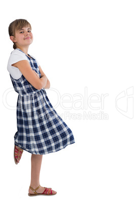 Cute girl standing with arms crossed on white background